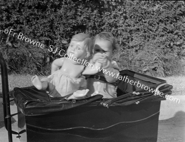 BABY IN PRAM WITH DOLL